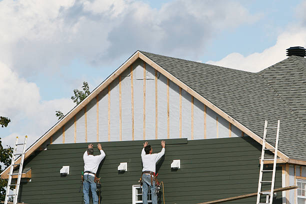 Professional Vinyl Siding technician working in Spring Valley, NY